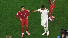 Lamine Yamal #19 of Spain interacts with Cristiano Ronaldo #7 of Portugal.